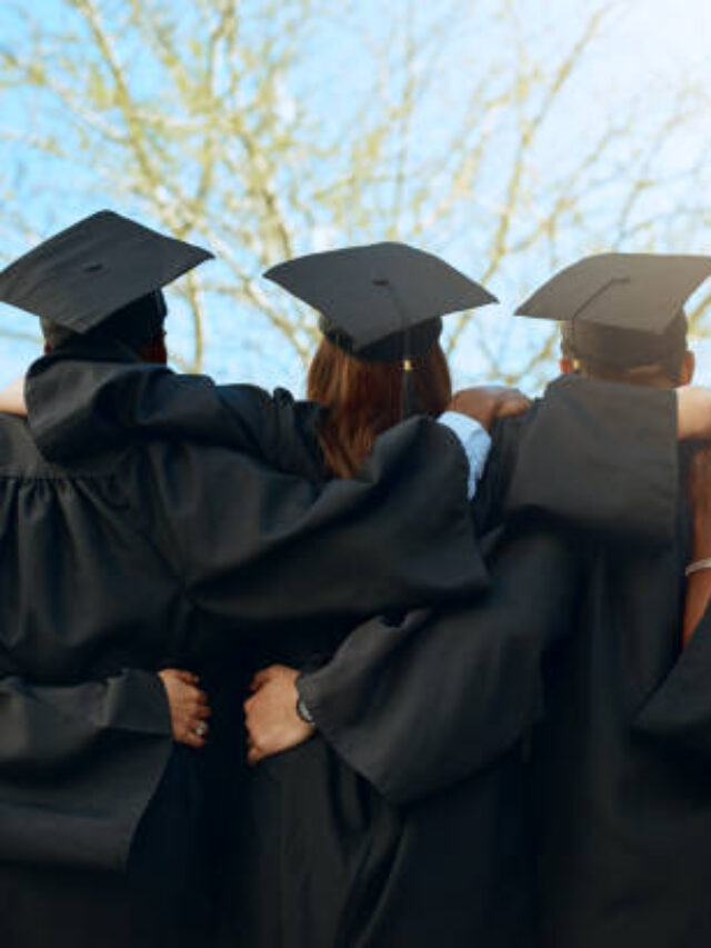 Rearview shot of a group of young students embracing on graduation day